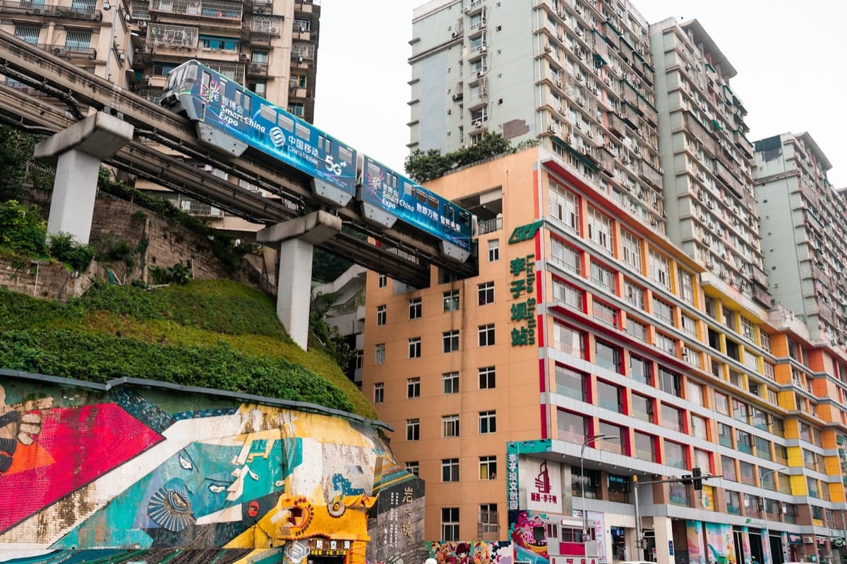 A real monorail train passing through the residential building at Chongqing’s Liziba station